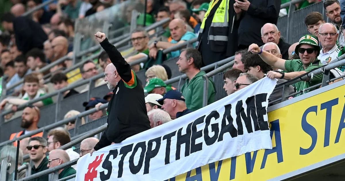 Fans holding a banner during a match