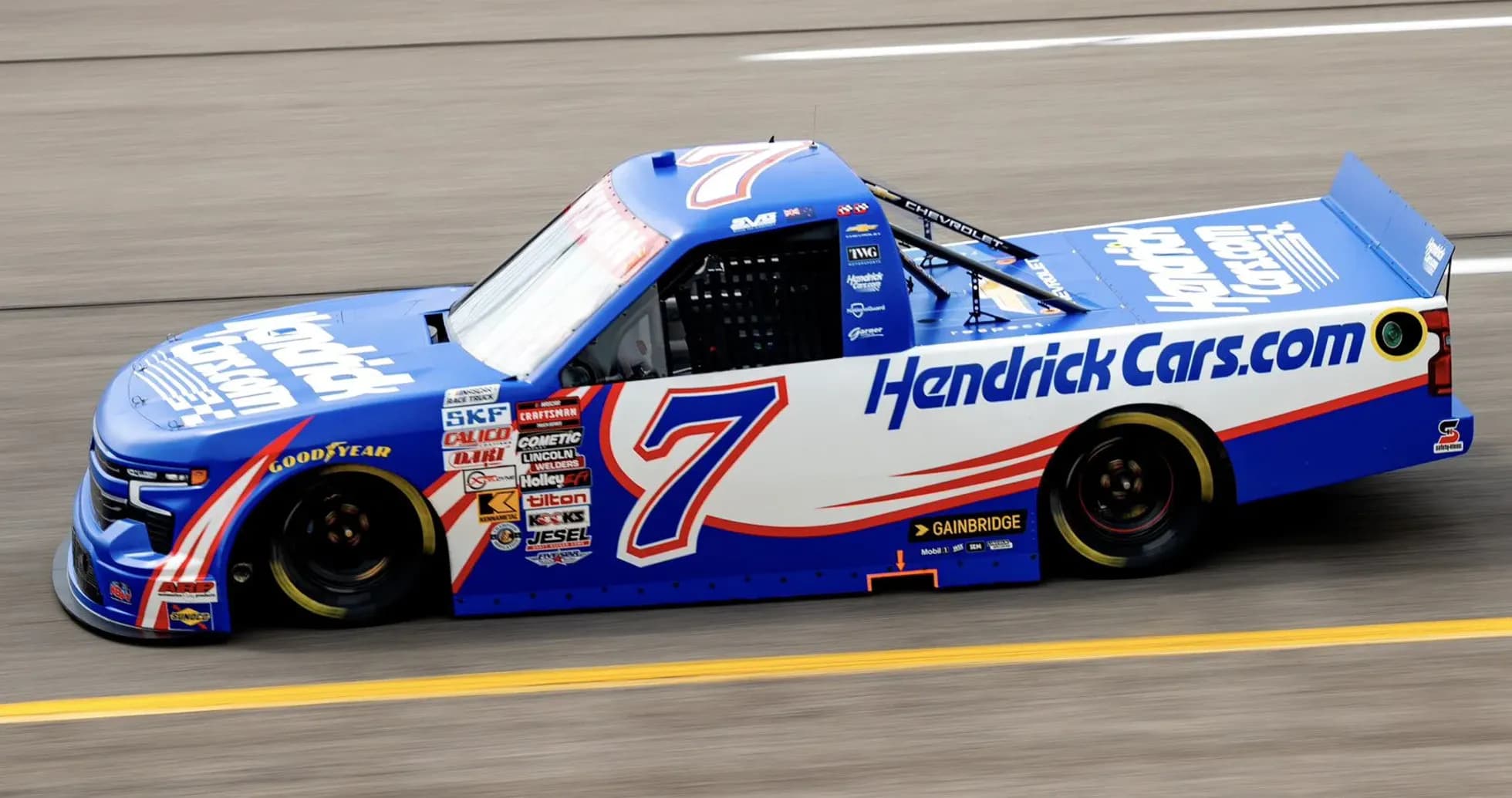 NASCAR truck number 7 racing on track