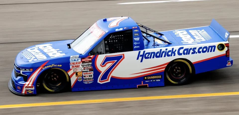 NASCAR truck number 7 racing on track