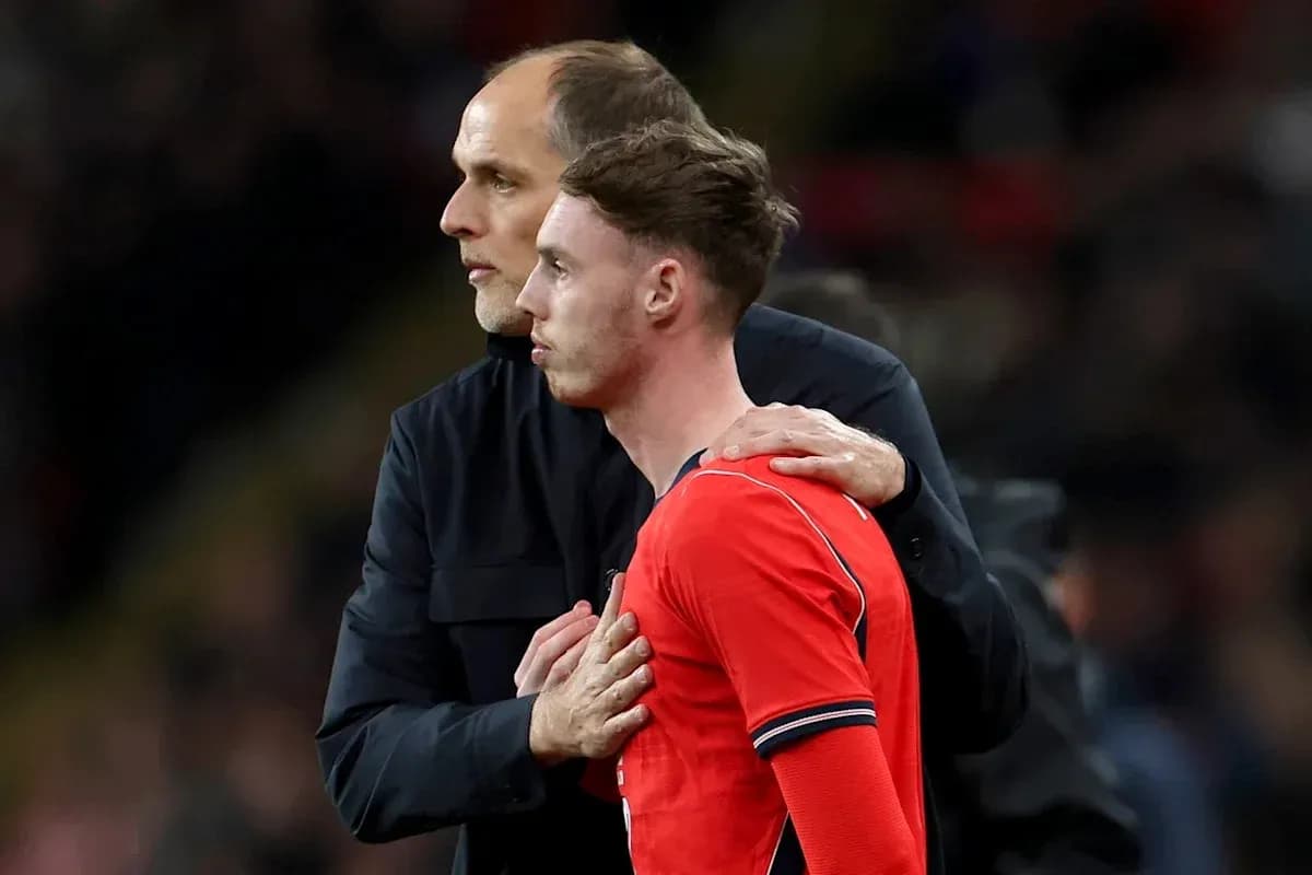 Coach talking to player during match substitution