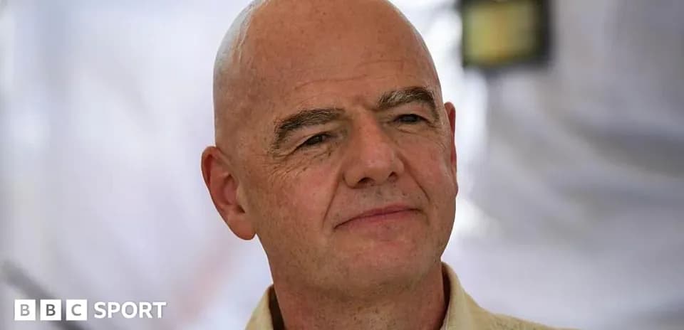Man with bald head speaking at event