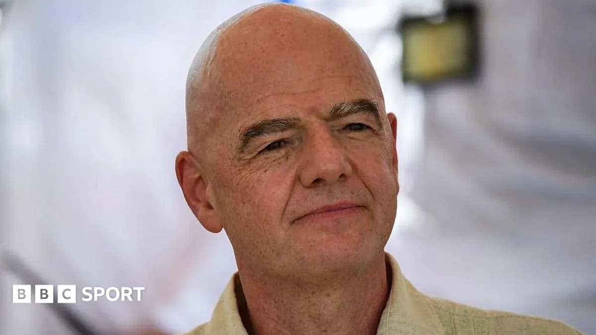 Man with bald head speaking at event