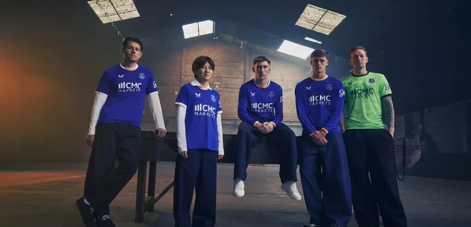 Everton players posing in new team jerseys