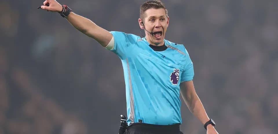 Referee signaling during a football match