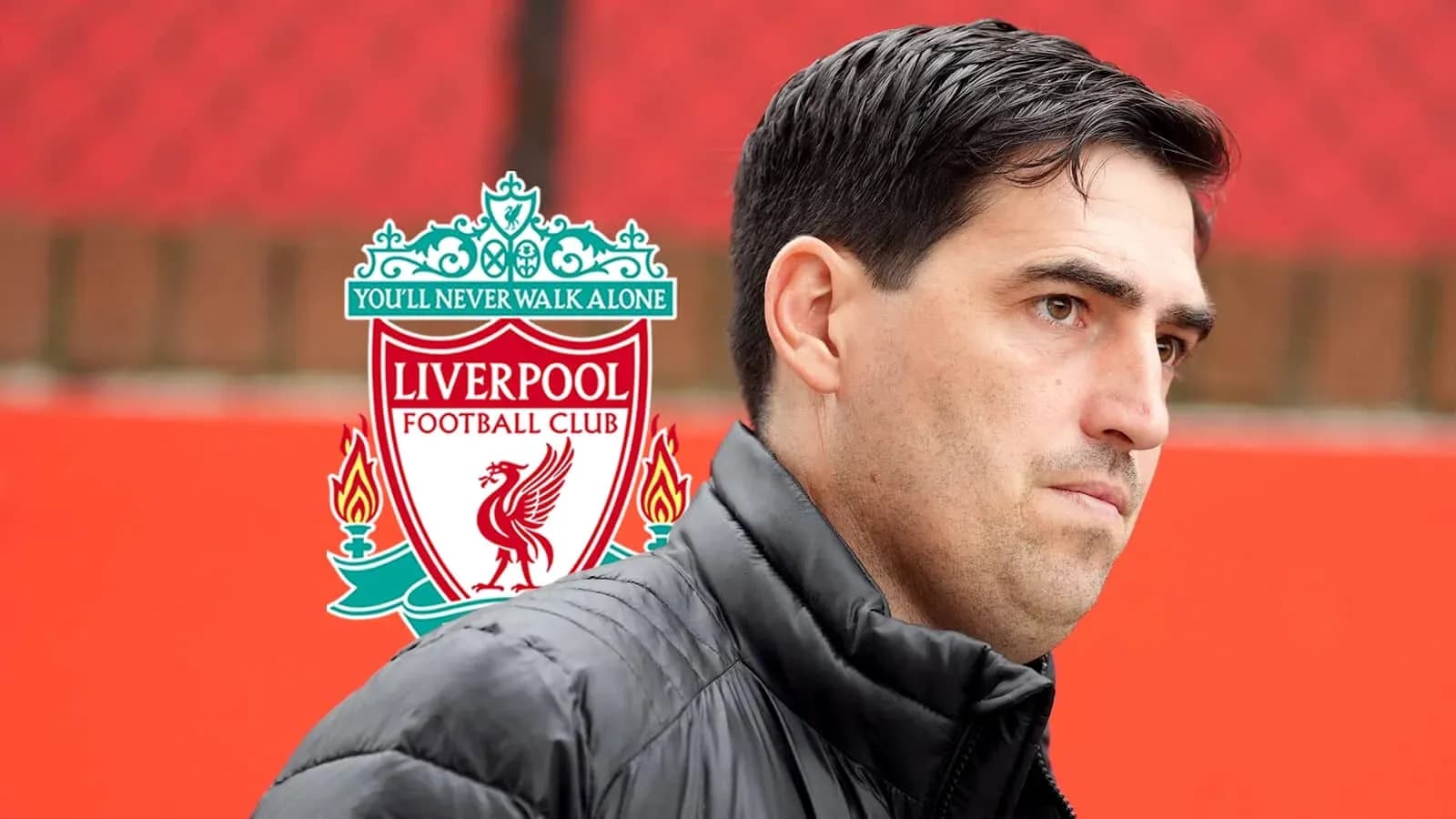 Man standing in front of Liverpool FC logo