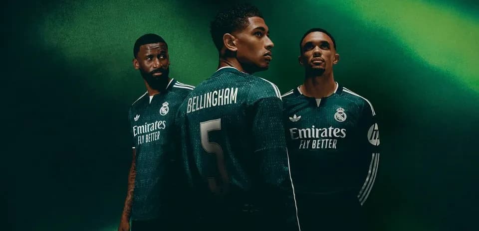 Real Madrid players posing in new green jerseys