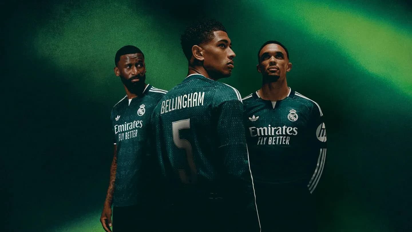 Real Madrid players posing in new green jerseys
