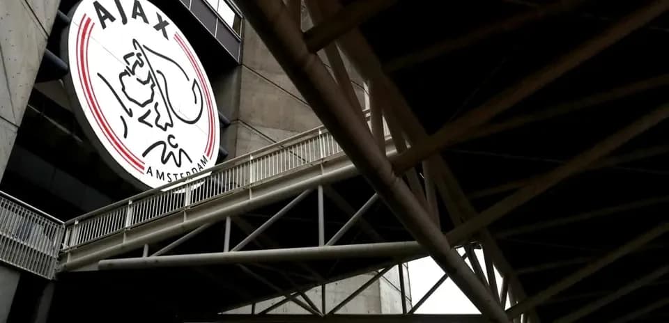 Ajax Amsterdam logo on stadium exterior wall