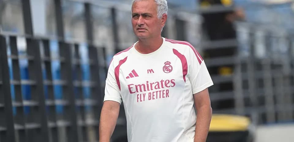 Mourinho walking on training pitch in Real Madrid kit