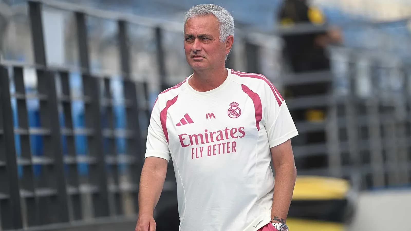 Mourinho walking on training pitch in Real Madrid kit