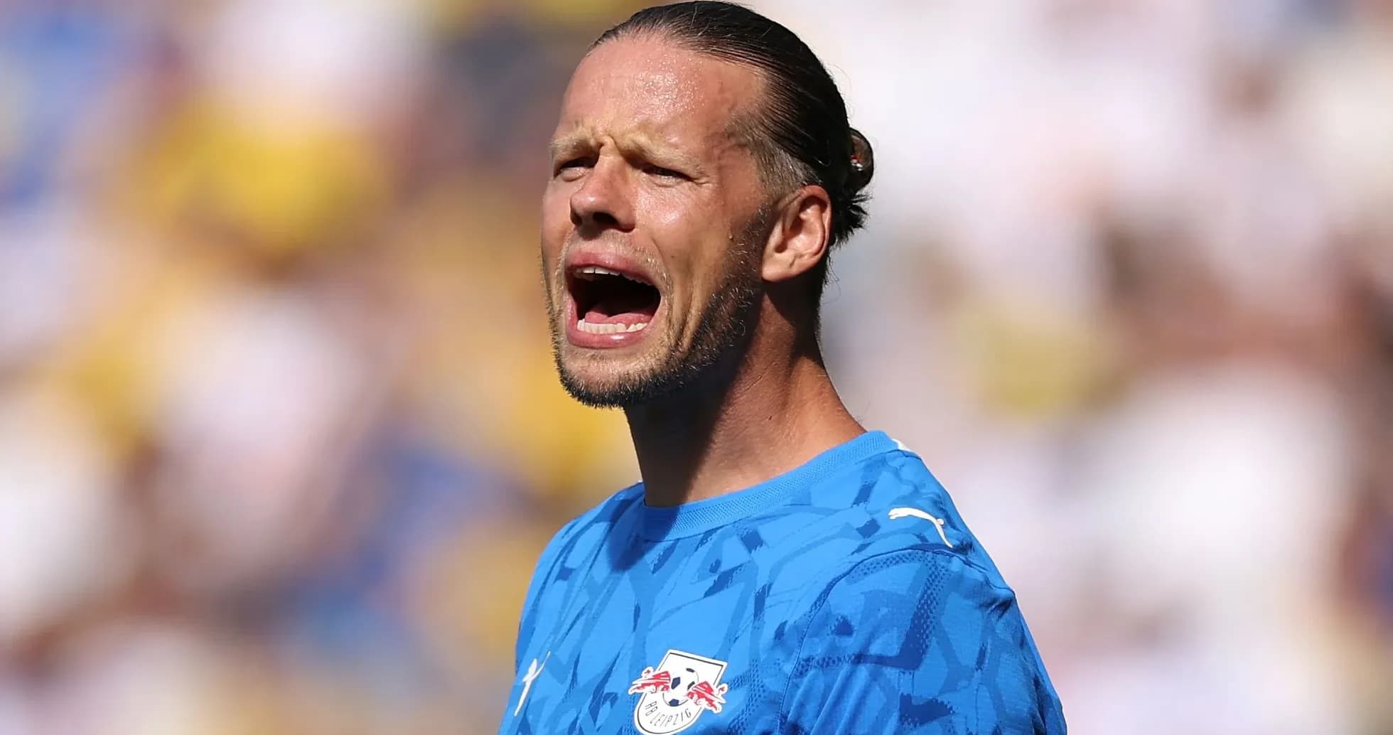 Goalkeeper shouting during a match on the field