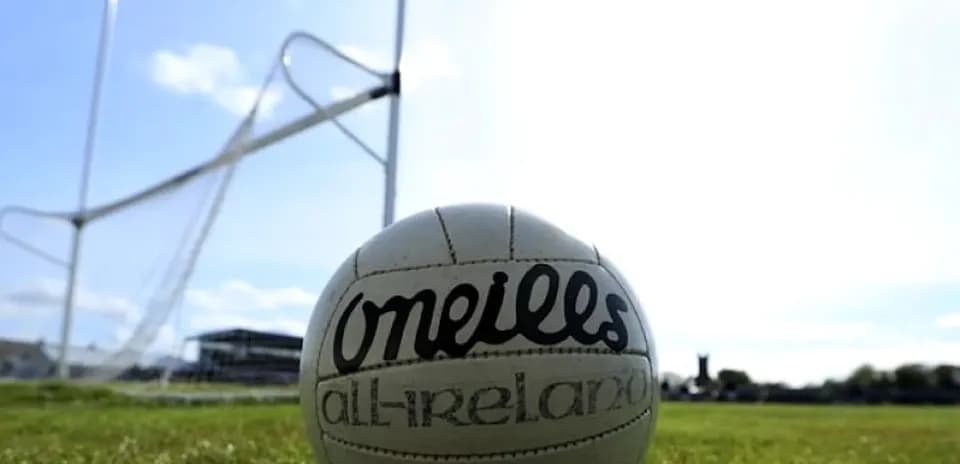 GAA football on field near goalposts