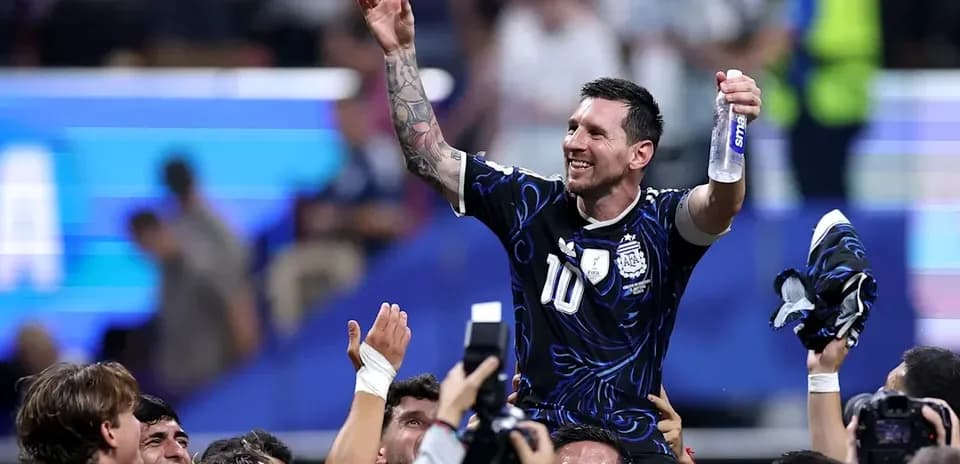 Messi celebrating with teammates after match victory