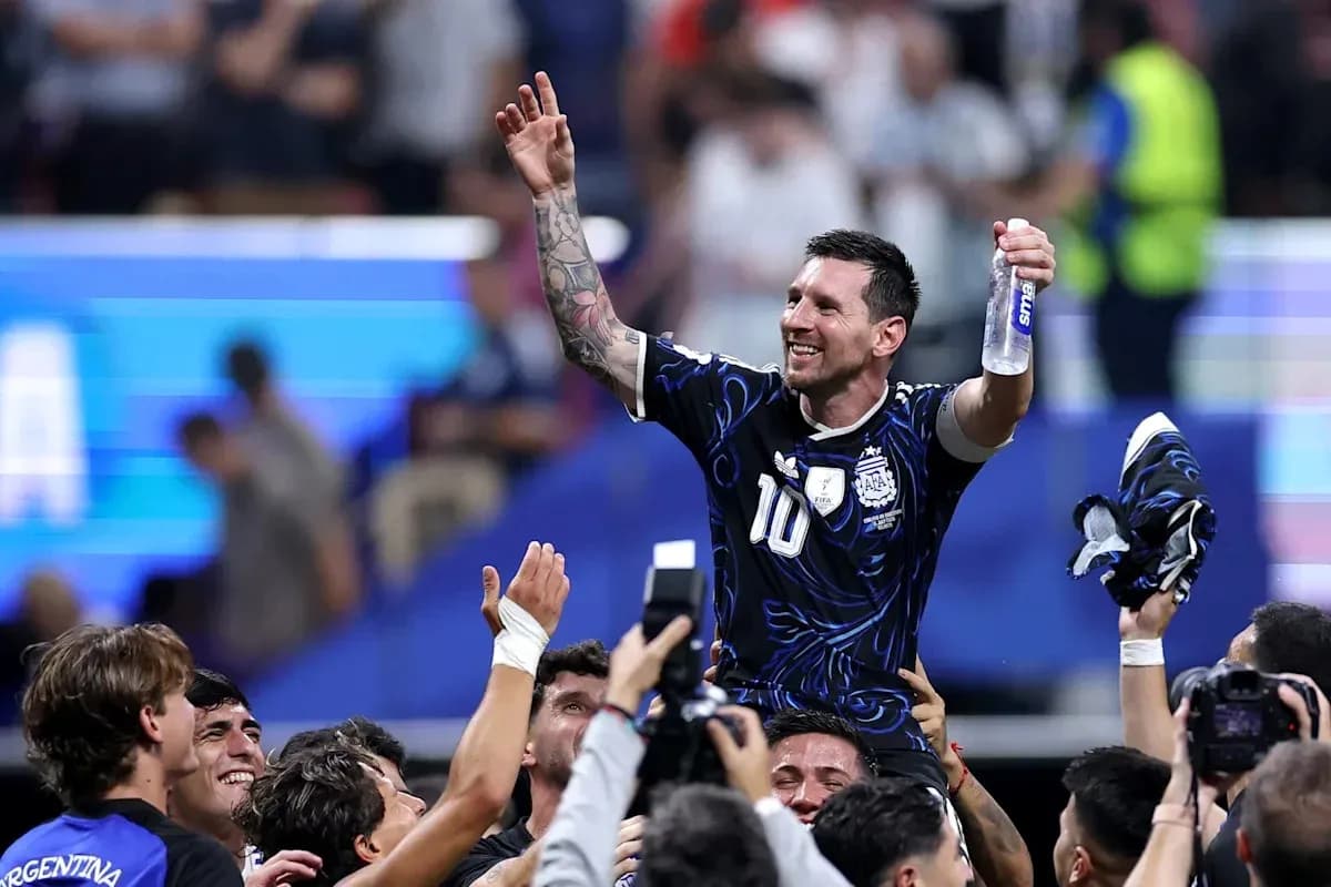 Messi celebrating with teammates after match victory