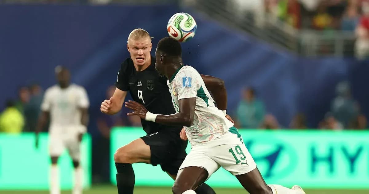 Two players competing for the ball during match
