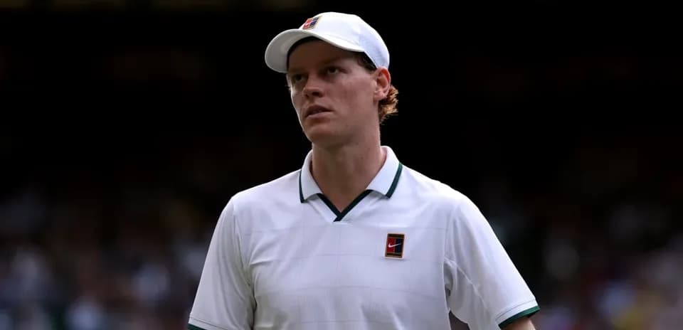 Tennis player walking on court at Wimbledon