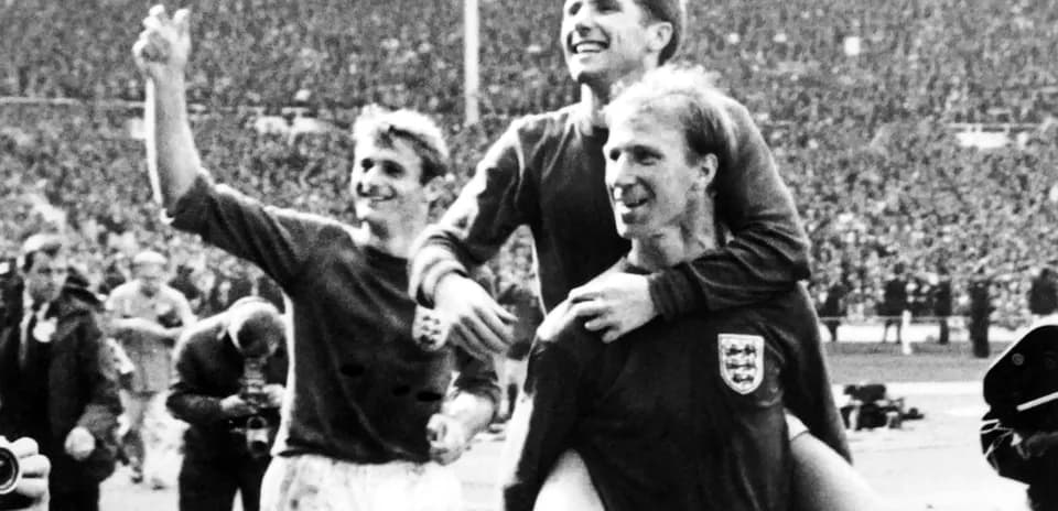 England players celebrating victory on the pitch