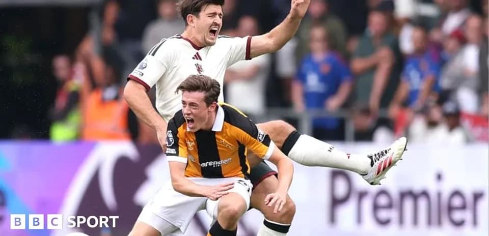 Two players colliding during a football match