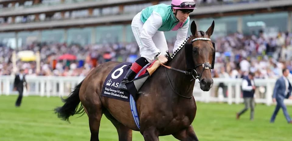 Jockey riding horse at racing event with spectators