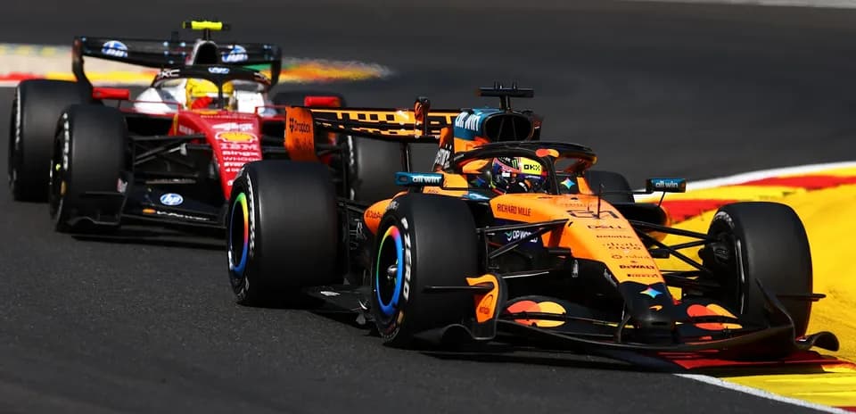 McLaren and Ferrari cars racing on track