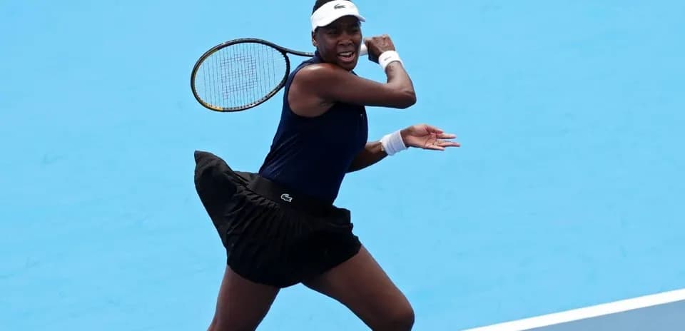 Tennis player executing a forehand stroke on court