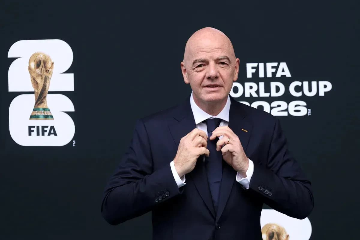 FIFA president adjusting tie at World Cup event
