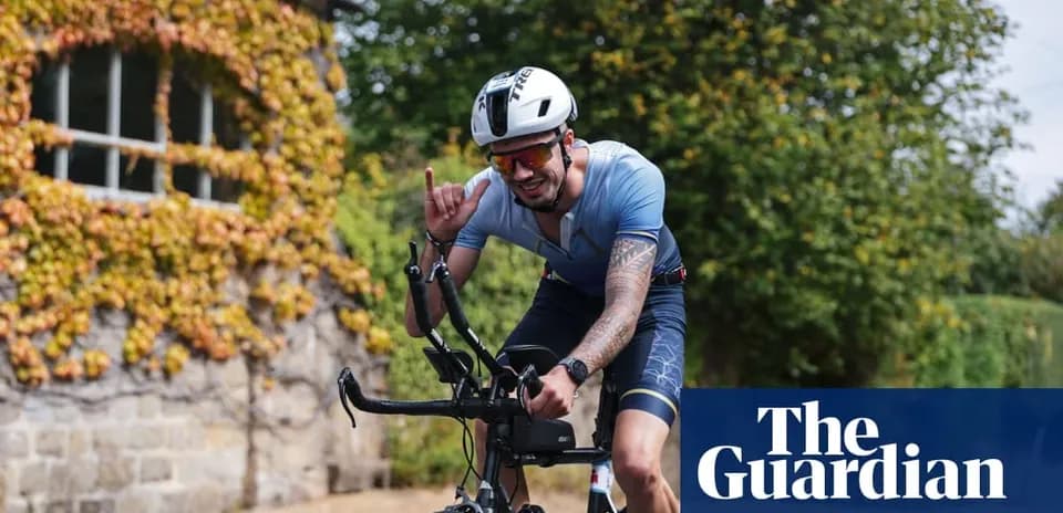 Biker signaling with hand while riding outdoors
