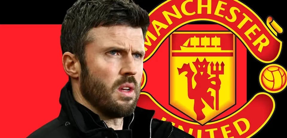 Man standing in front of Manchester United logo