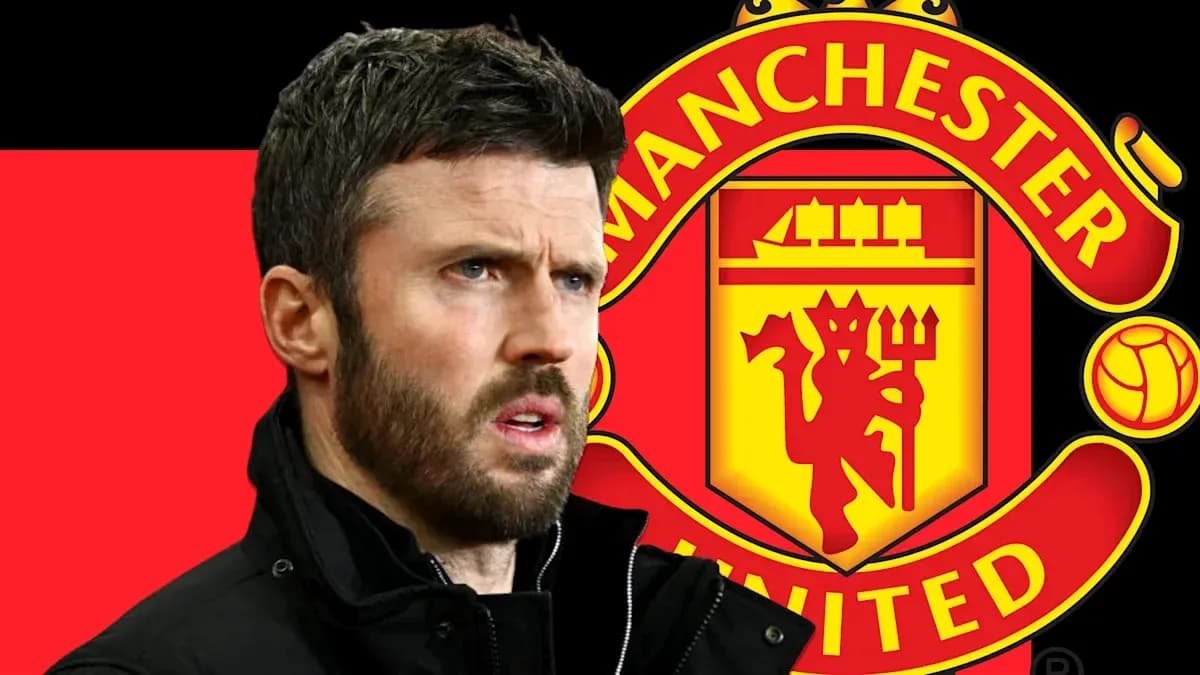 Man standing in front of Manchester United logo