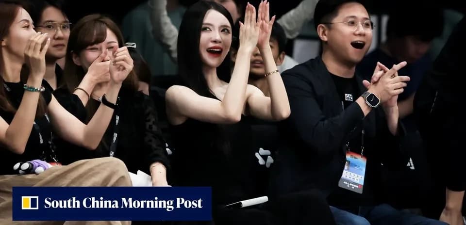 Audience members clapping at an event