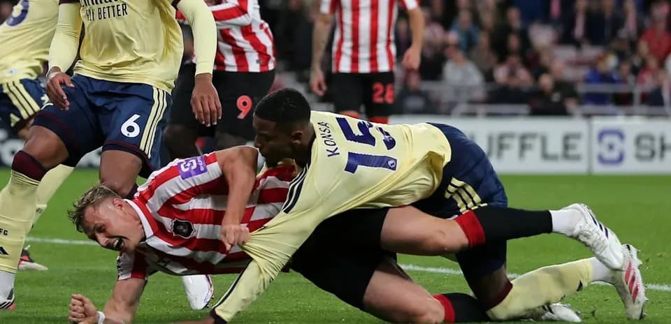 Player tackled on the ground during football match
