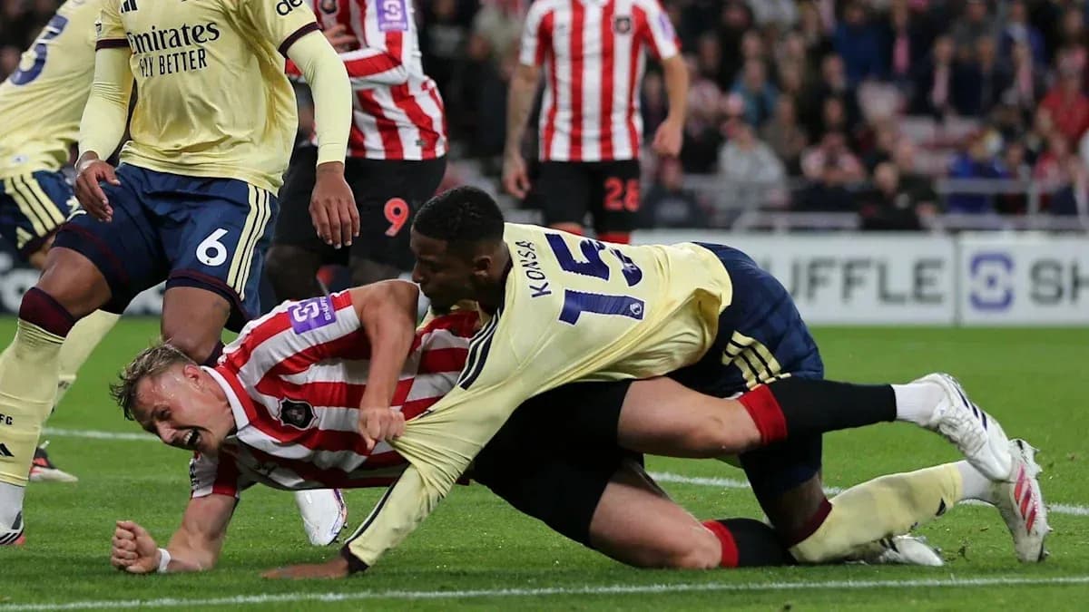 Player tackled on the ground during football match