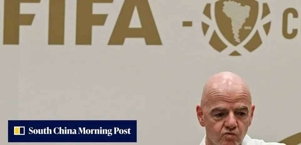 FIFA official speaking at press conference backdrop
