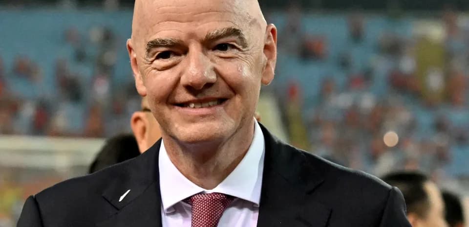 FIFA president smiling at football event