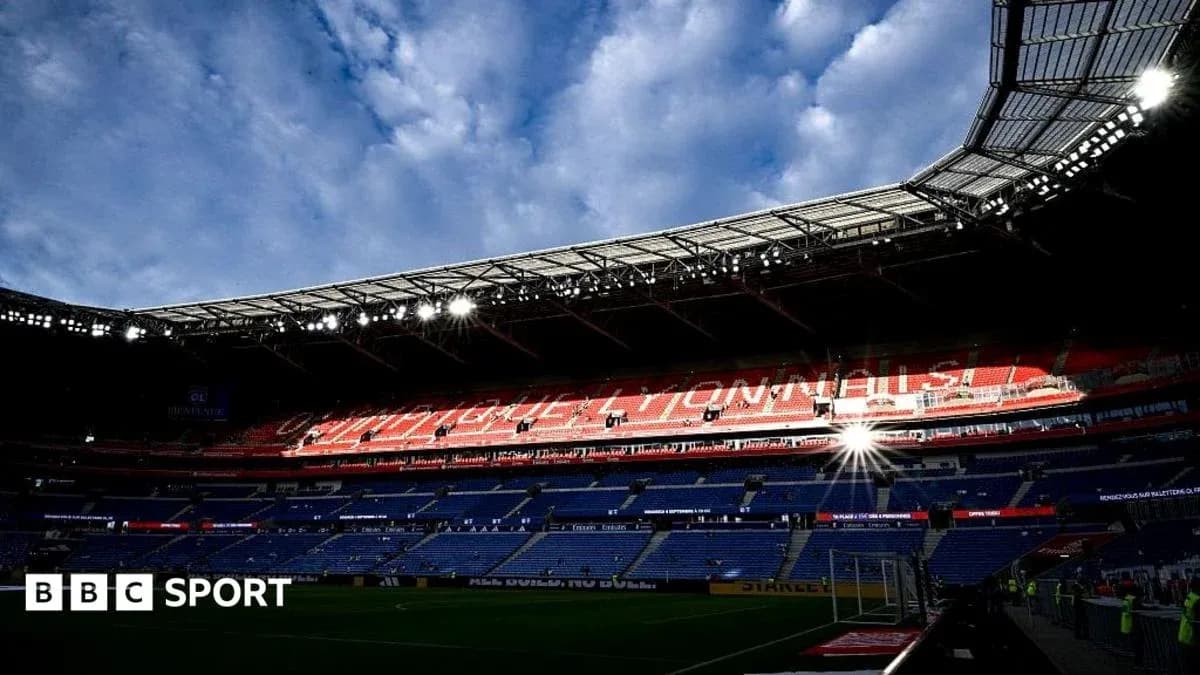 Stadium interior with empty seats and cloudy sky