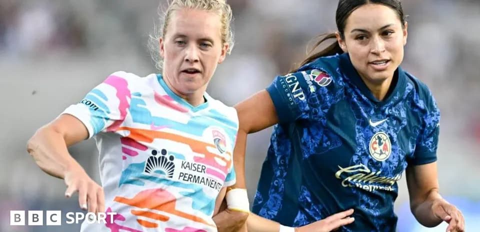Two female football players competing for the ball