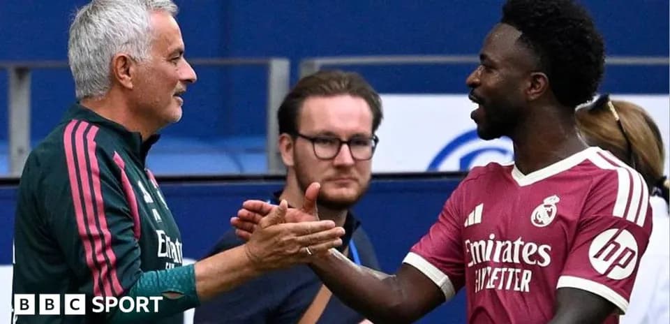 Men shaking hands during football match interaction