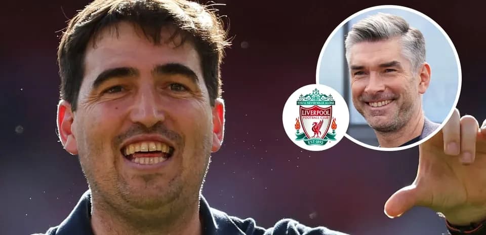 Football coach celebrating with Liverpool badge in background