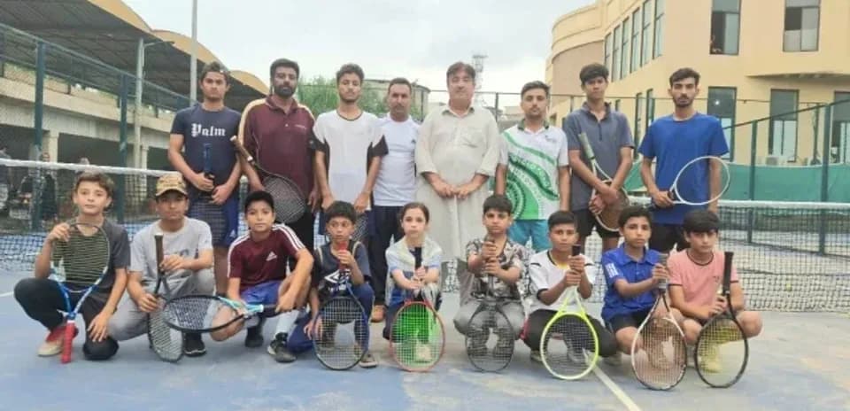 Tennis group photo with players on court