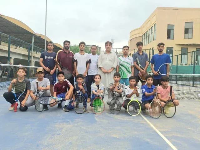 Tennis group photo with players on court