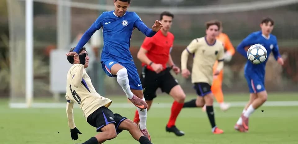 Player in blue evading a tackle during match