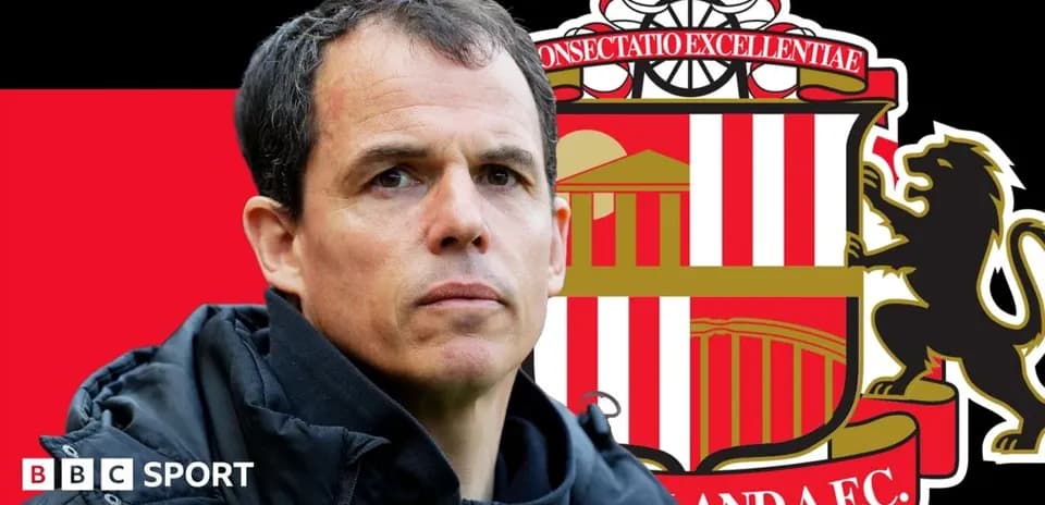 Sunderland manager in front of club logo