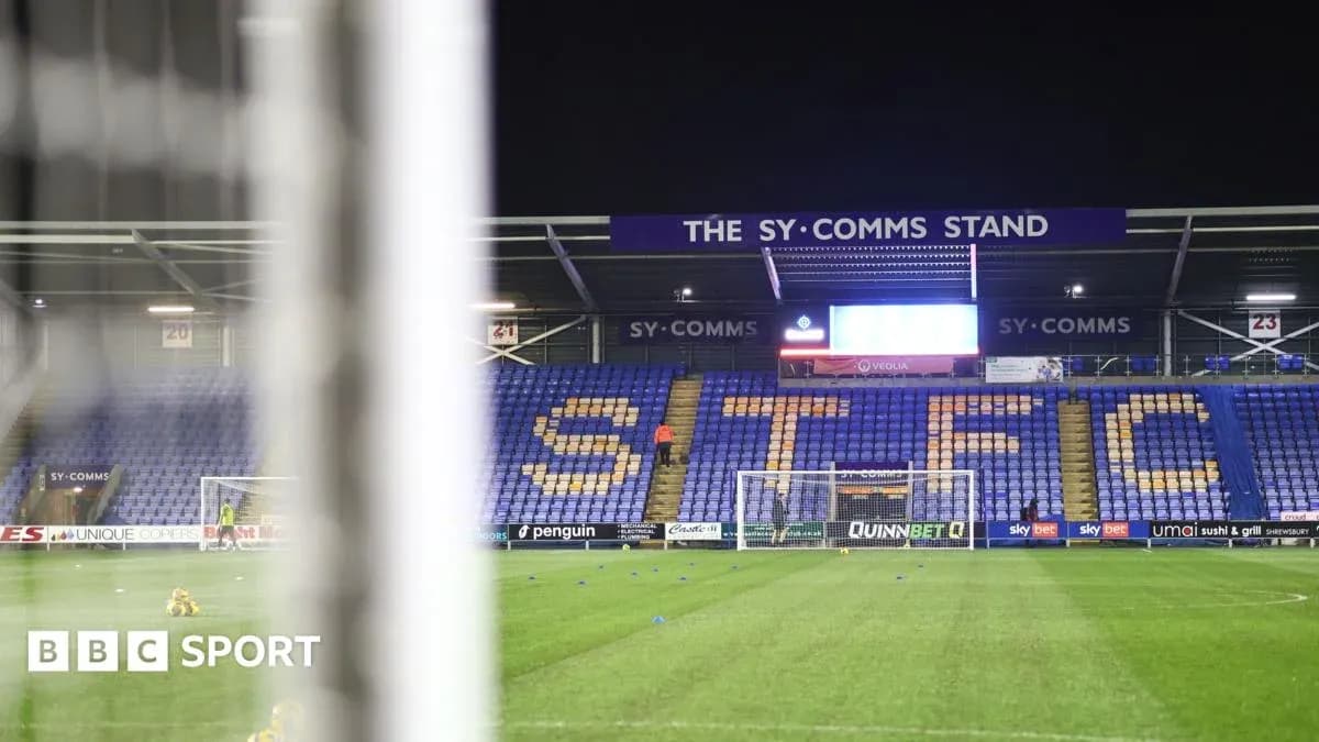 Shrewsbury Town stadium with empty stands and goal