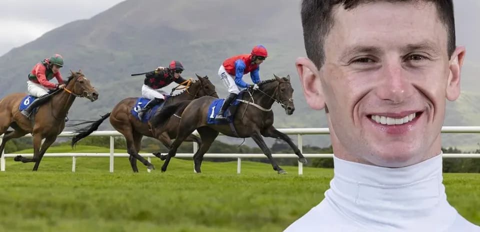 Jockeys racing on horses at a racecourse