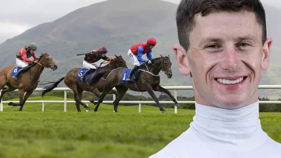 Jockeys racing on horses at a racecourse