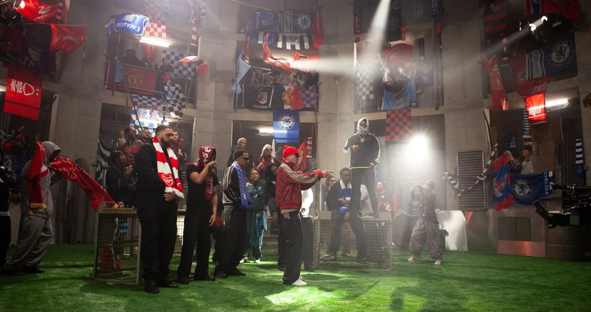 Fans with flags gathered in a stadium-like setting