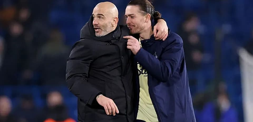 Coaches celebrating together after the match
