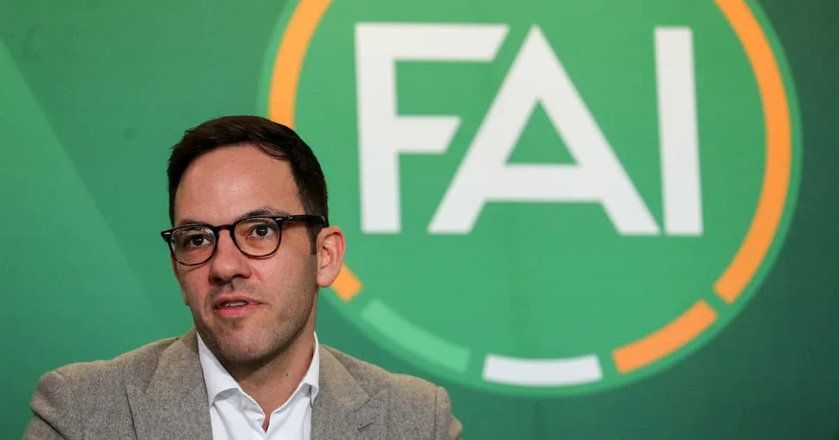 Man speaking at FAI press conference backdrop