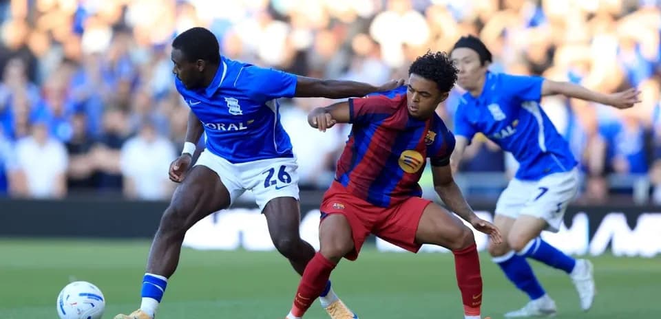 Birmingham City and Barcelona players battling for possession