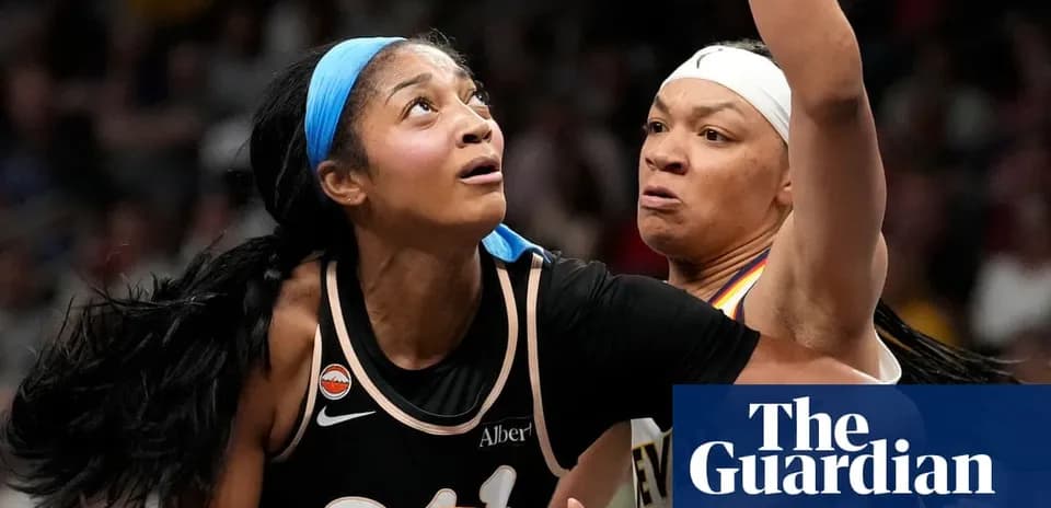 Two basketball players competing for the ball